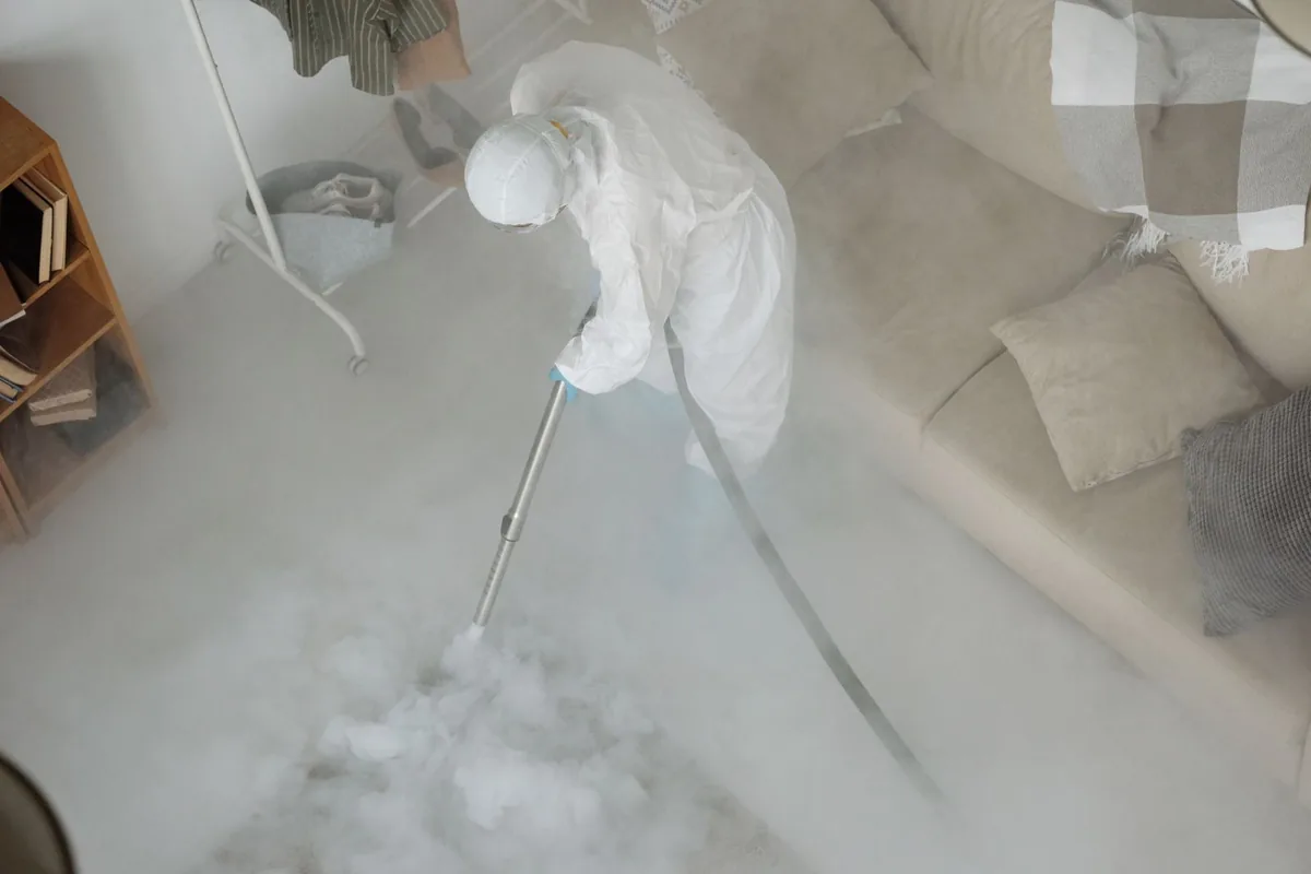 Biohazard cleanup technician in protective equipment, Cranston, RI